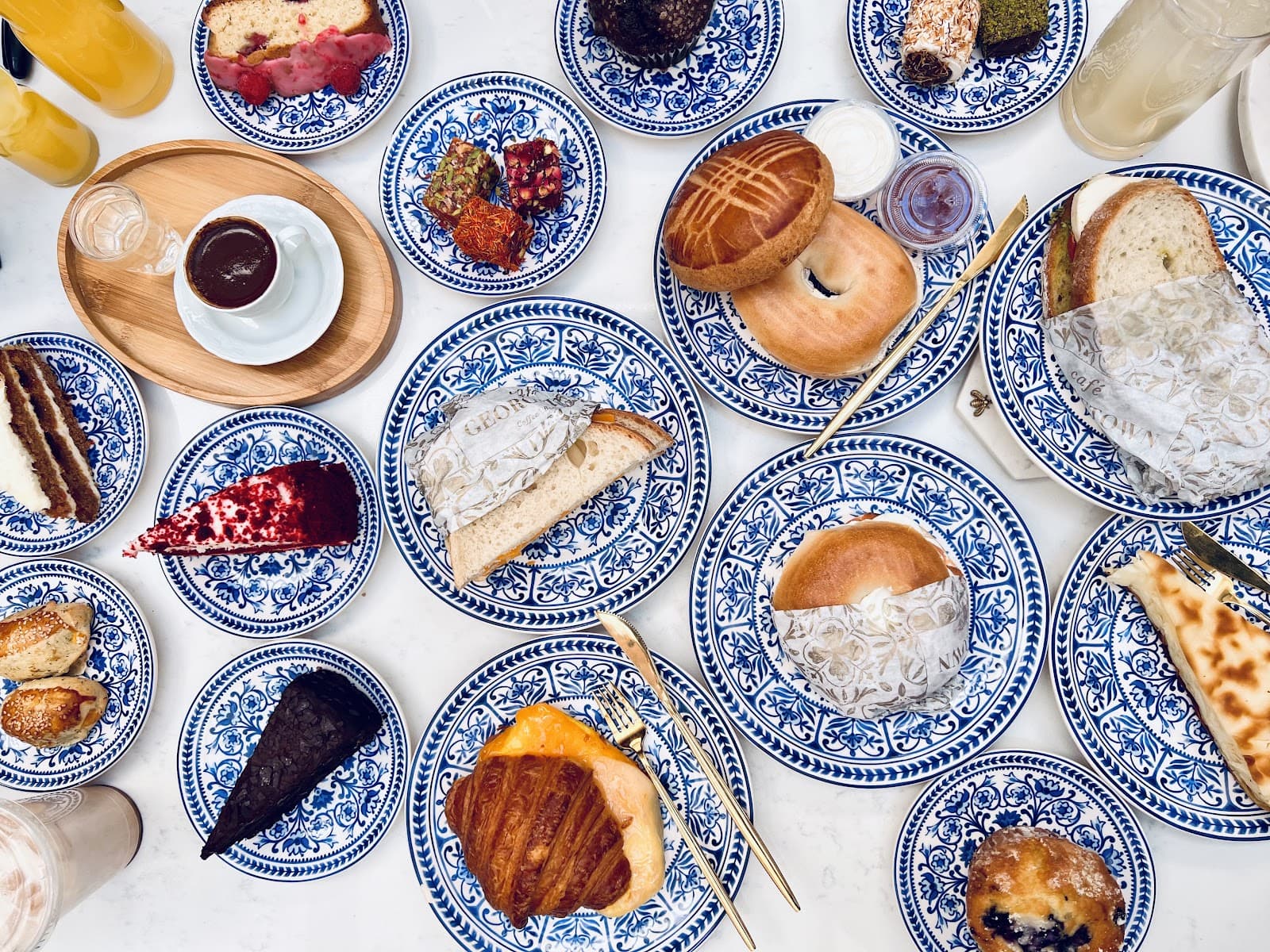 Café Georgetown interior — royal blue walls, marble bar, warm ambient light at 3141 N St NW Georgetown DC